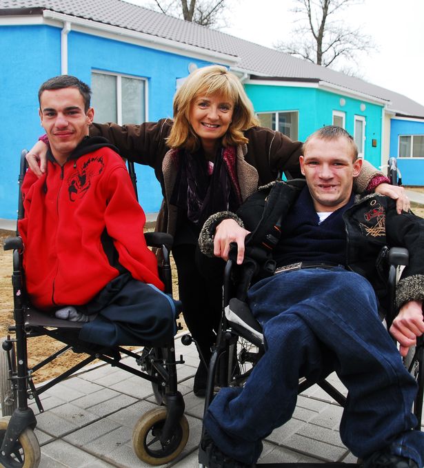 Adi with youths at opening of new houses