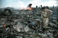 Emergency crews inspect the debris at the crash site of the Malaysian airliner near the village of Grabovo, Ukraine - See more 